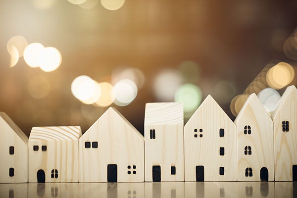 House model on wood table. Real estate agent offer house, property insurance and security, affordable housing concepts