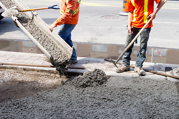 City workers pouring cement for a project