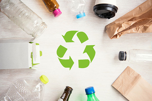 Recyclable items around a recycle symbol