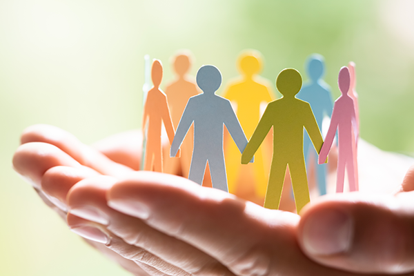 diversity hands holding people paper cutouts