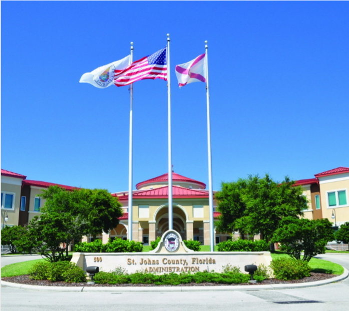 Saint John's county Florida Adminstration building with 3 flags waving.