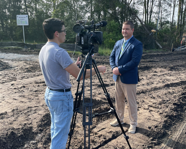 staff being interviewed by media