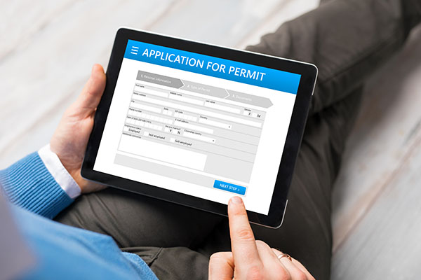 Applying for a building permit on a tablet