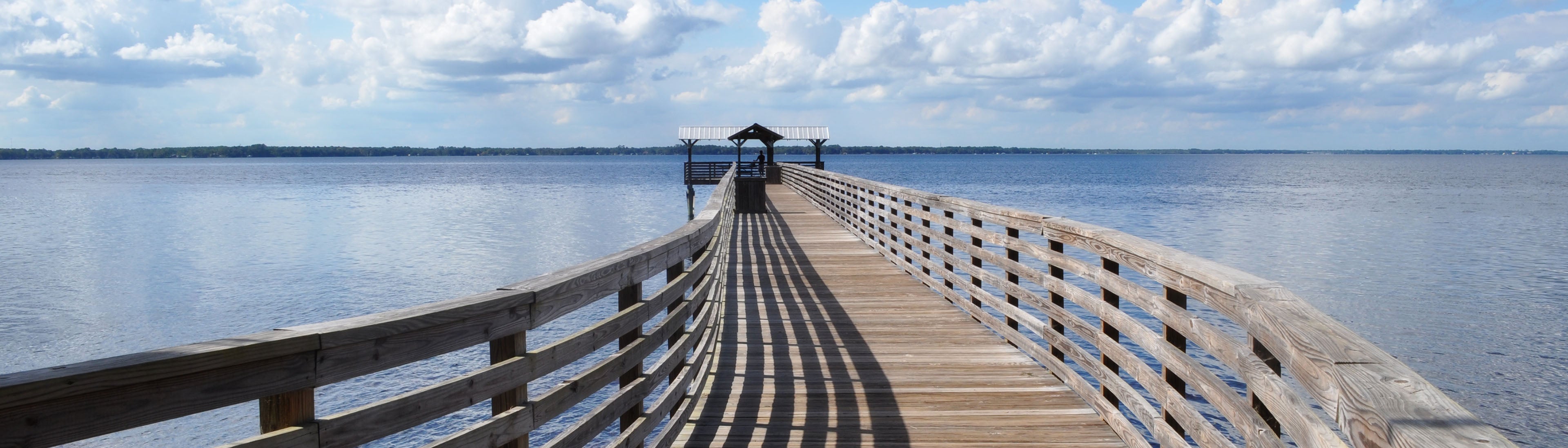 Alpine Groves Pier leading to ocean and clouds