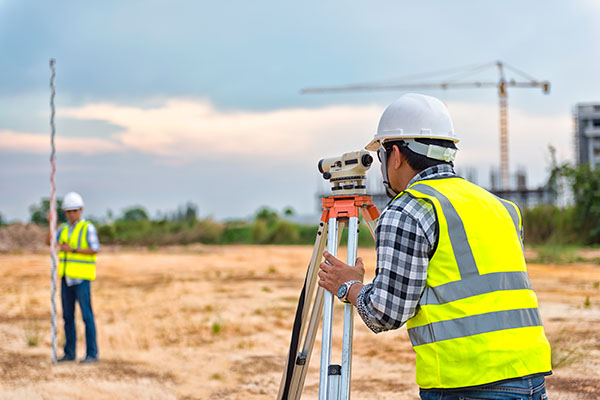 Surveyor on development site