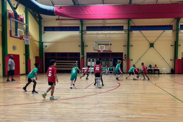 kids playing basketball in a gym