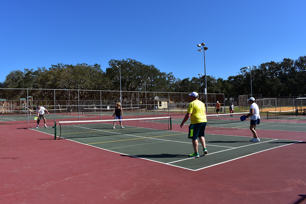 people playing paddleball at Ron Parker park