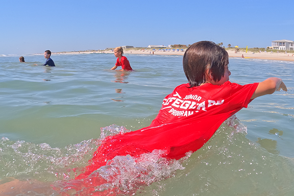 young swimmer paddling