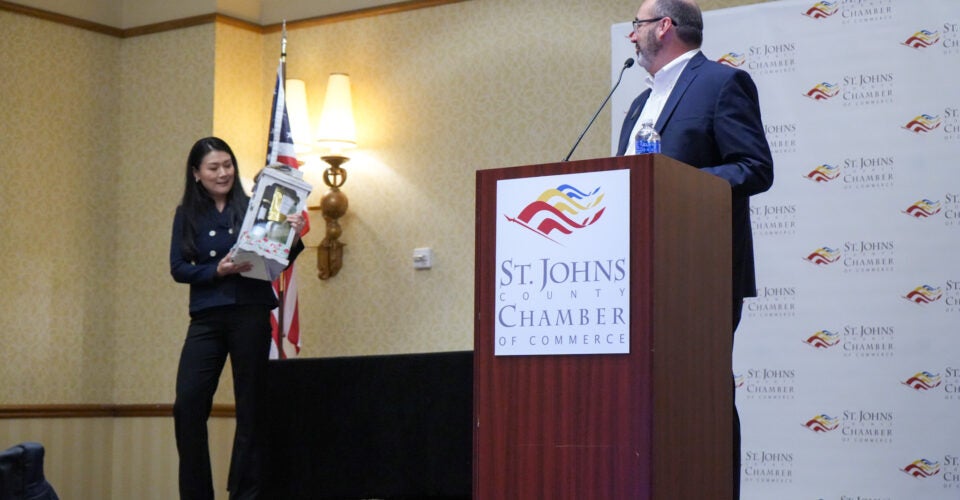 Joy receiving award at event
