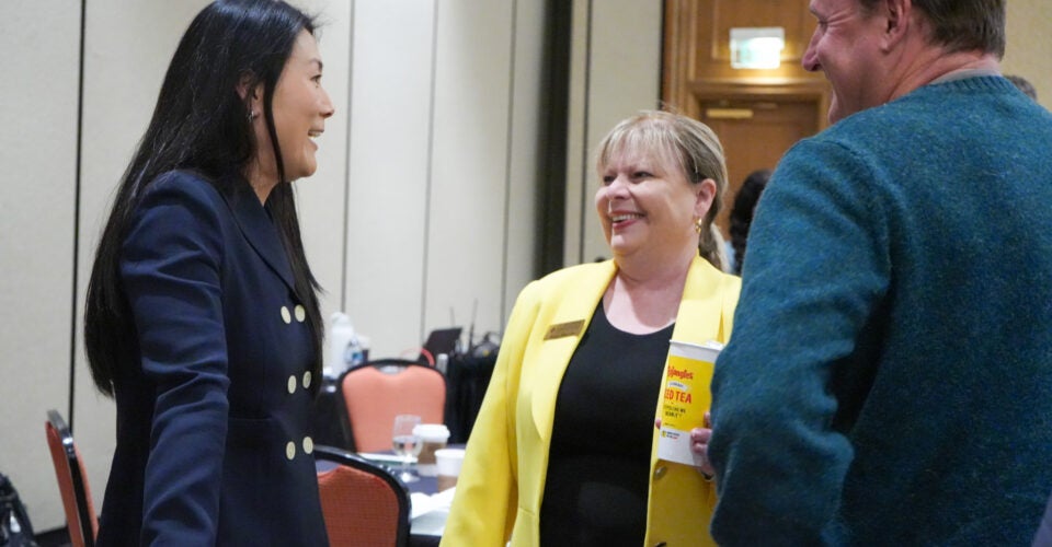 Joy speaking to event attendees