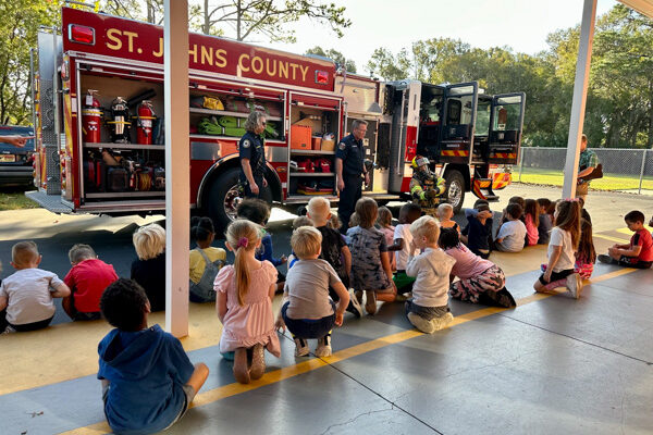 firefighter teaching children