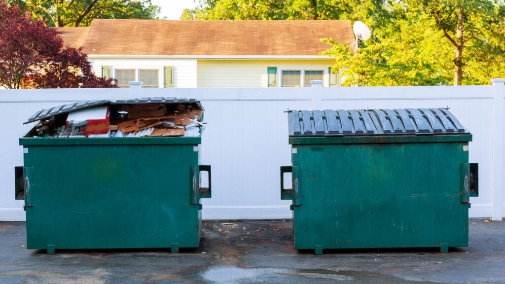 two green dumpsters