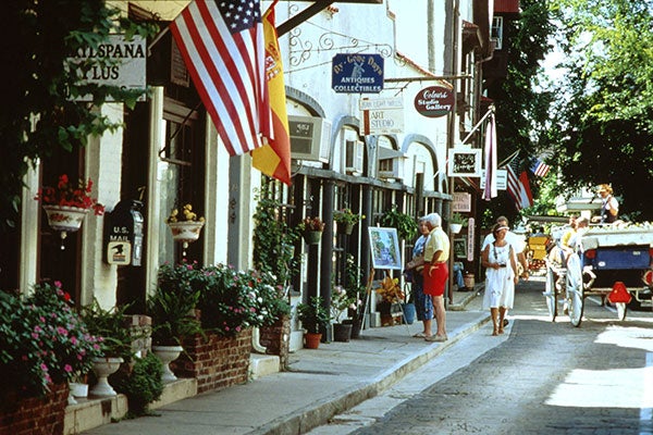 street view of shops and tourists on Aviles St