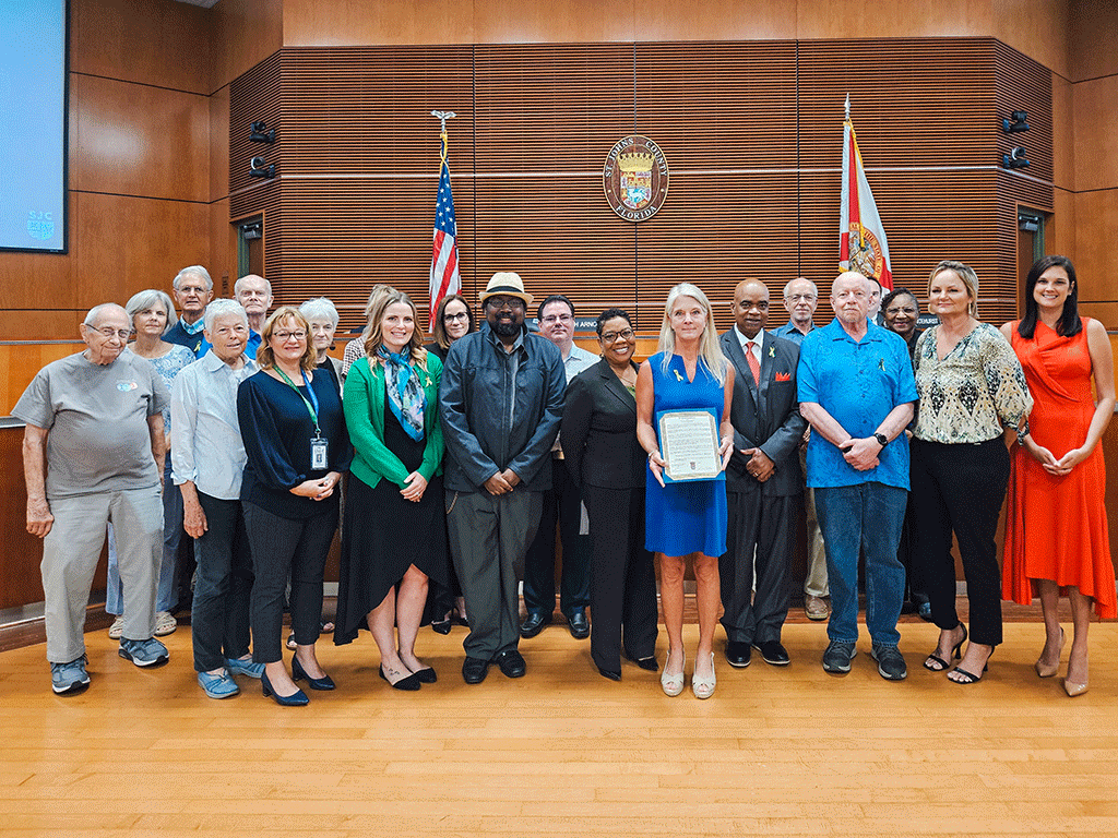 Sarah Arnold, Board Chair, District 2 and representatives from Patients Not Prisoners recognize Mental Health Awareness Month.