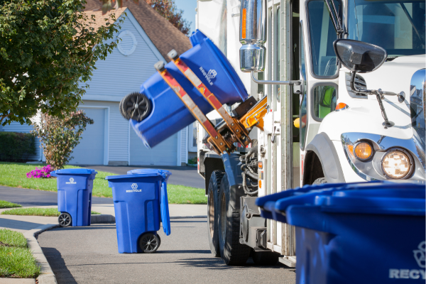 recycling truck picking up a recycling cart