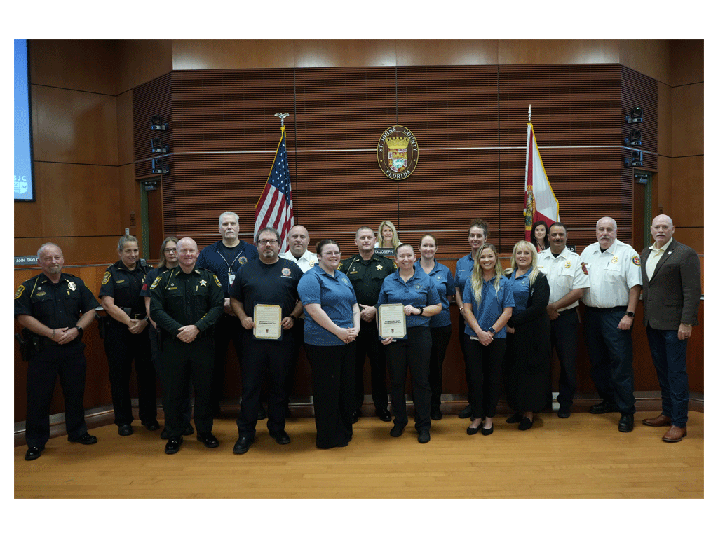 Commissioner Murphy presents the National Public Safety Telecommunicators Week proclamation at the April 14 commission meeting.
