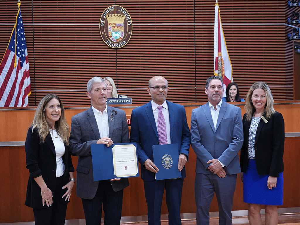 Commissioner Ann Taylor presents Water Conservation Month proclamation to Utilities Department