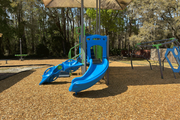 A covered slide on a playground.
