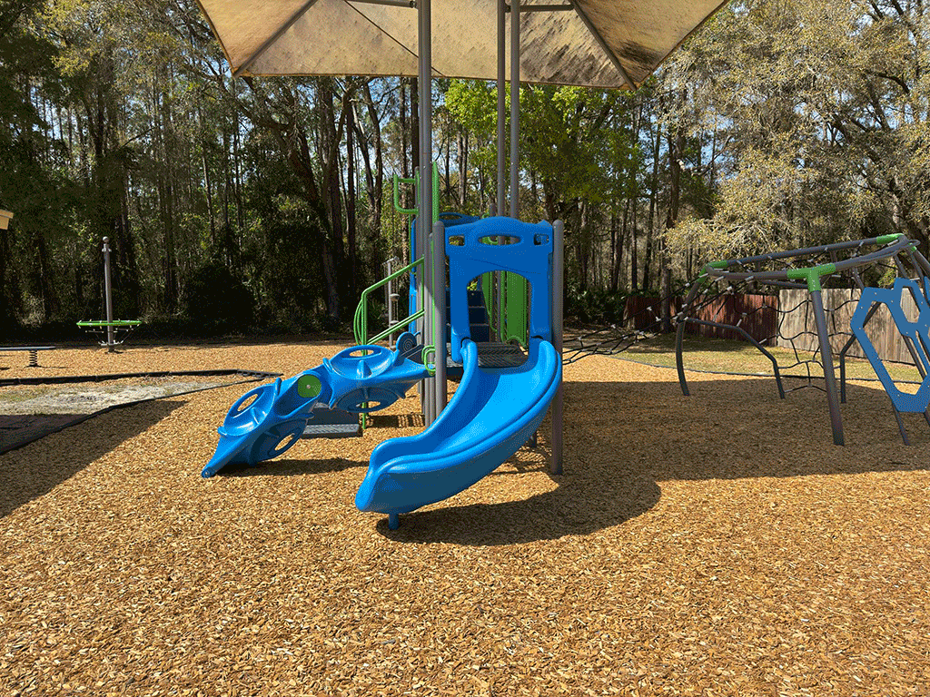 A covered slide on a playground.