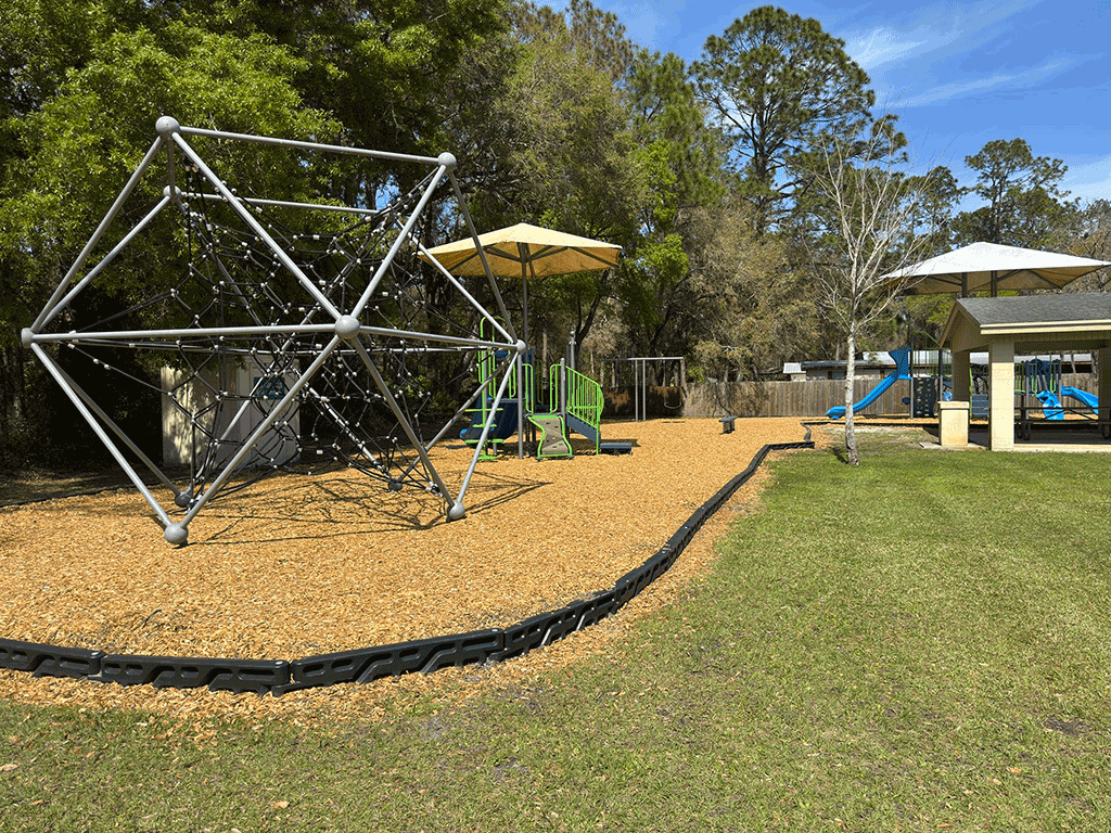 Multiple play structures on a children’s playground.
