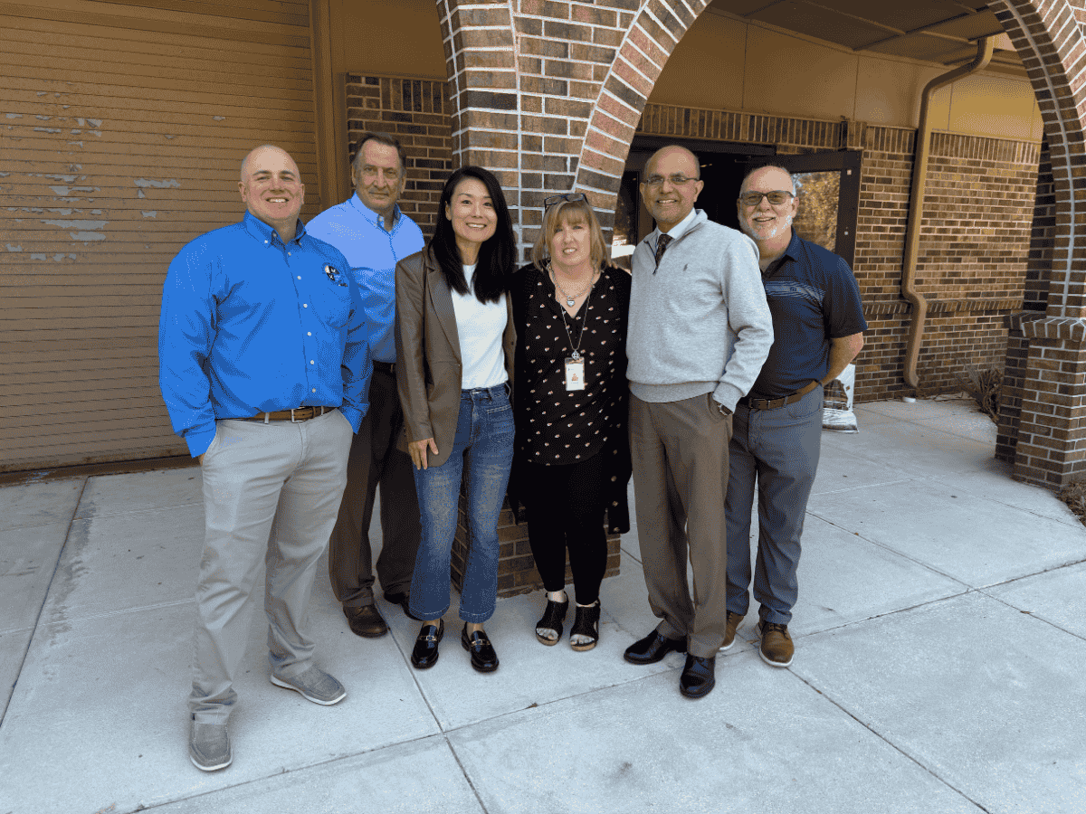 From left to right, Larry Miller, Gordon Smith, Joy Andrews, Kim Carman, Neal Shinkre, Frank Kenton stand together as Kim Carman is recognized as the Utilities Employee of the Year