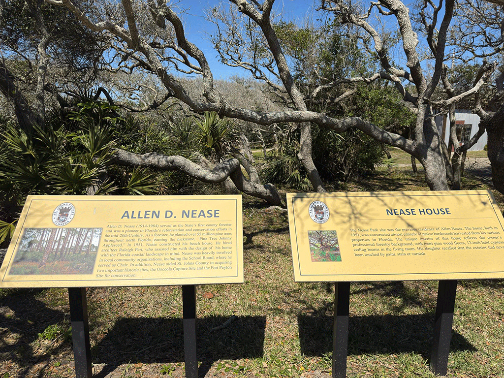 A pair of outdoor park signs explaining the histories of Allen D. Nease and the house that bears his name.