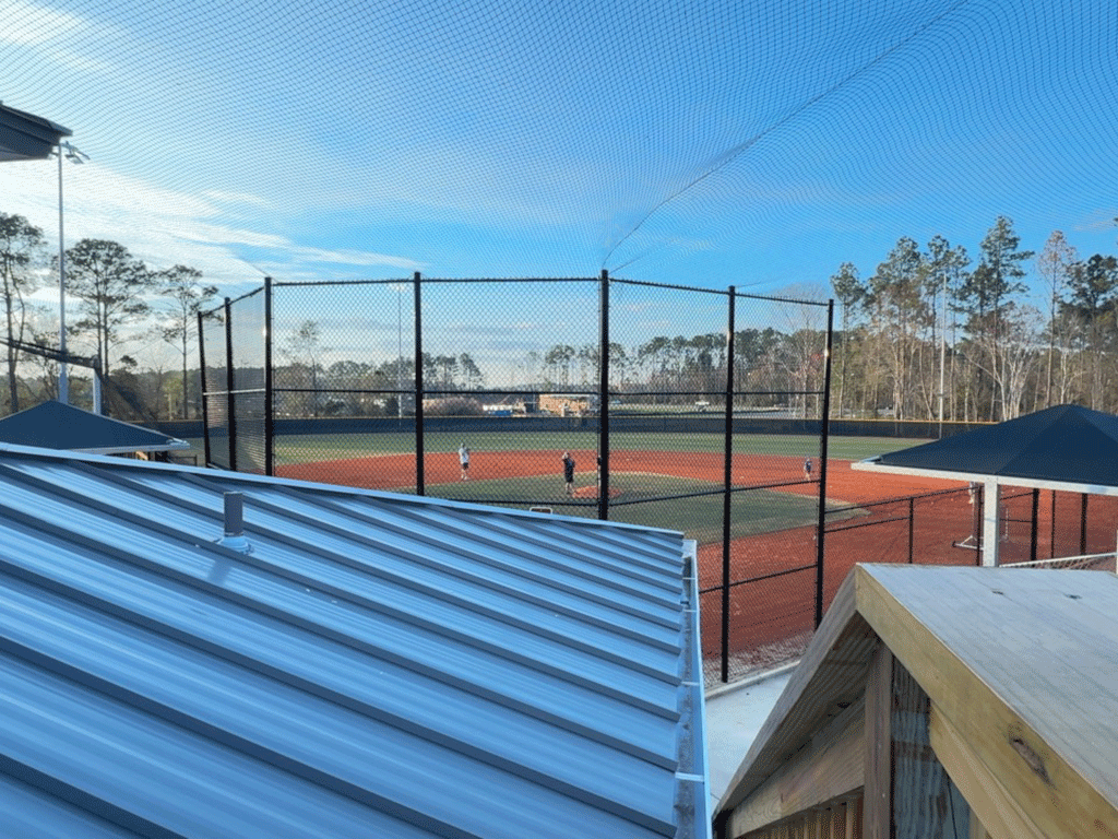 A high-angle view of people playing on a baseball field.