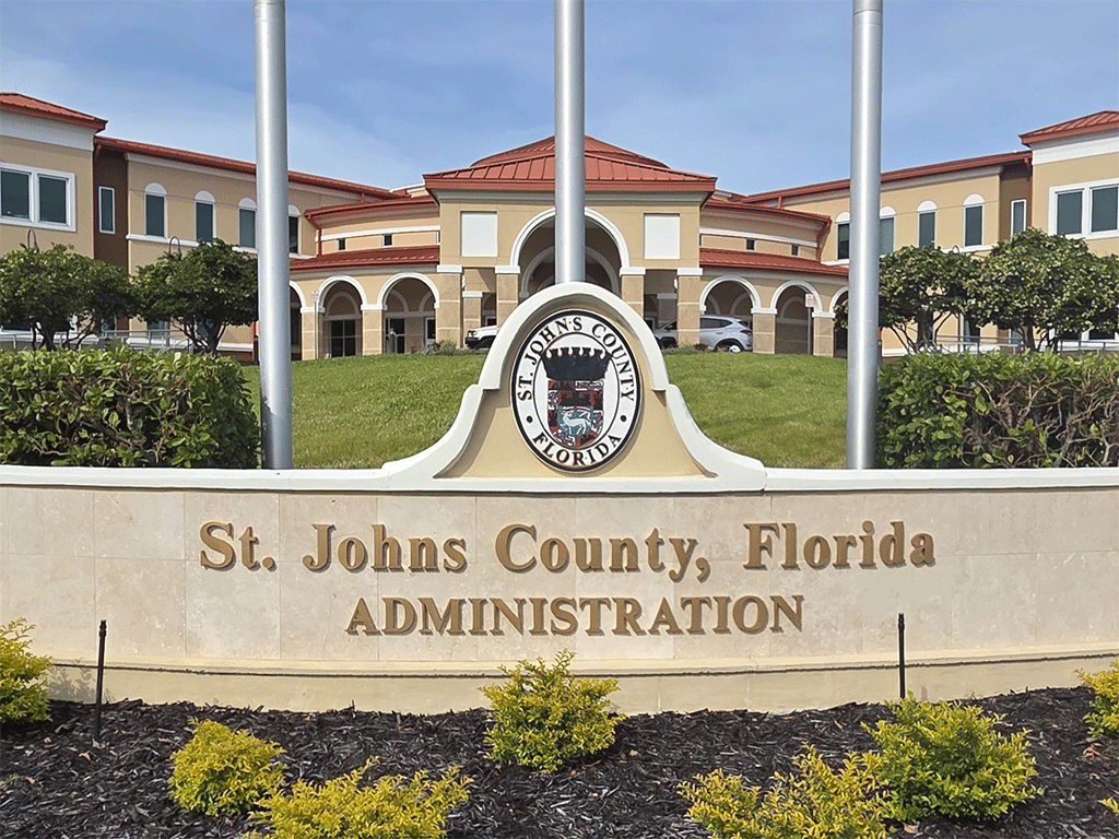 St. Johns County, Florida, Administration building front view of flag poles and landscaping