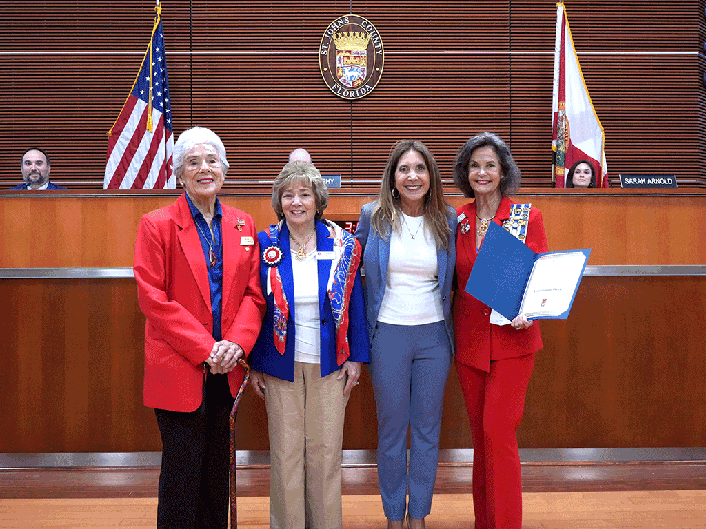 Commissioner Taylor presents the proclamation to the local chapter of the daughters of the American Revolution
