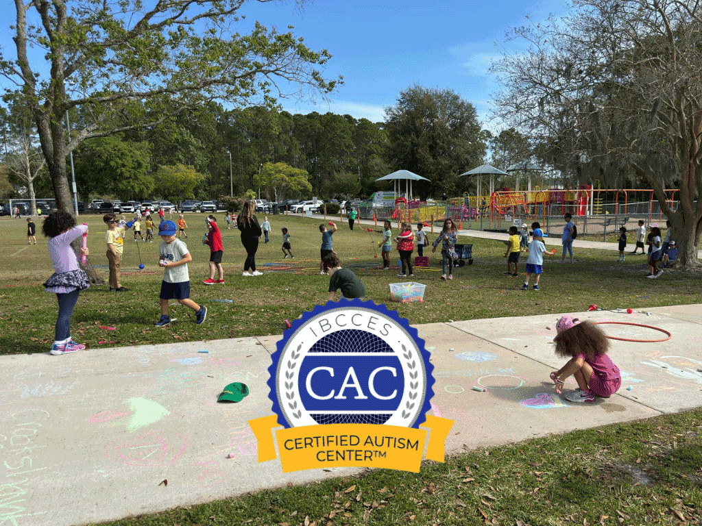 Children play at a playground in St. Johns County. The Certified Autism Center logo is pictured at the bottom of the image.