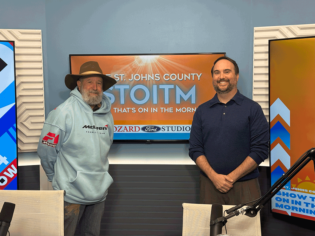 Commissioner Whitehurst poses in front of the 904 Show.