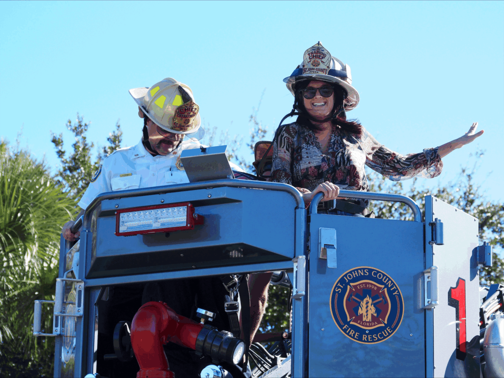 Commissioner Arnold, district 2, wearing a fire fighter hat.