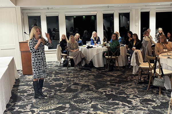 Commissioner Krista Joseph speaking at the Ponte Vedra Women's Club. Members are sitting at tables.