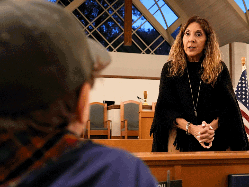 Commissioner Taylor speaks to a Cub Scout inside St. Francis in the Field Episcopal Church.