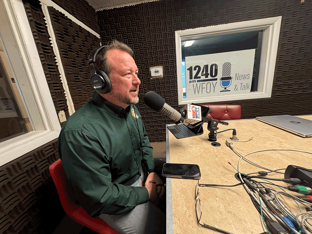 Public Works director, Greg Caldwell, speaking into a microphone.