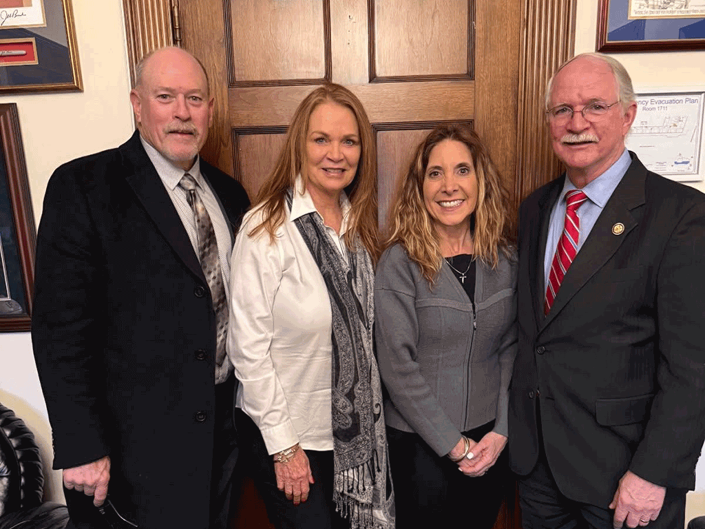 BCC Vice-Chair Taylor and Chair Murphy smile with Representative John. H Rutherford