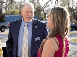 Commissioner Murphy talks to a woman outside